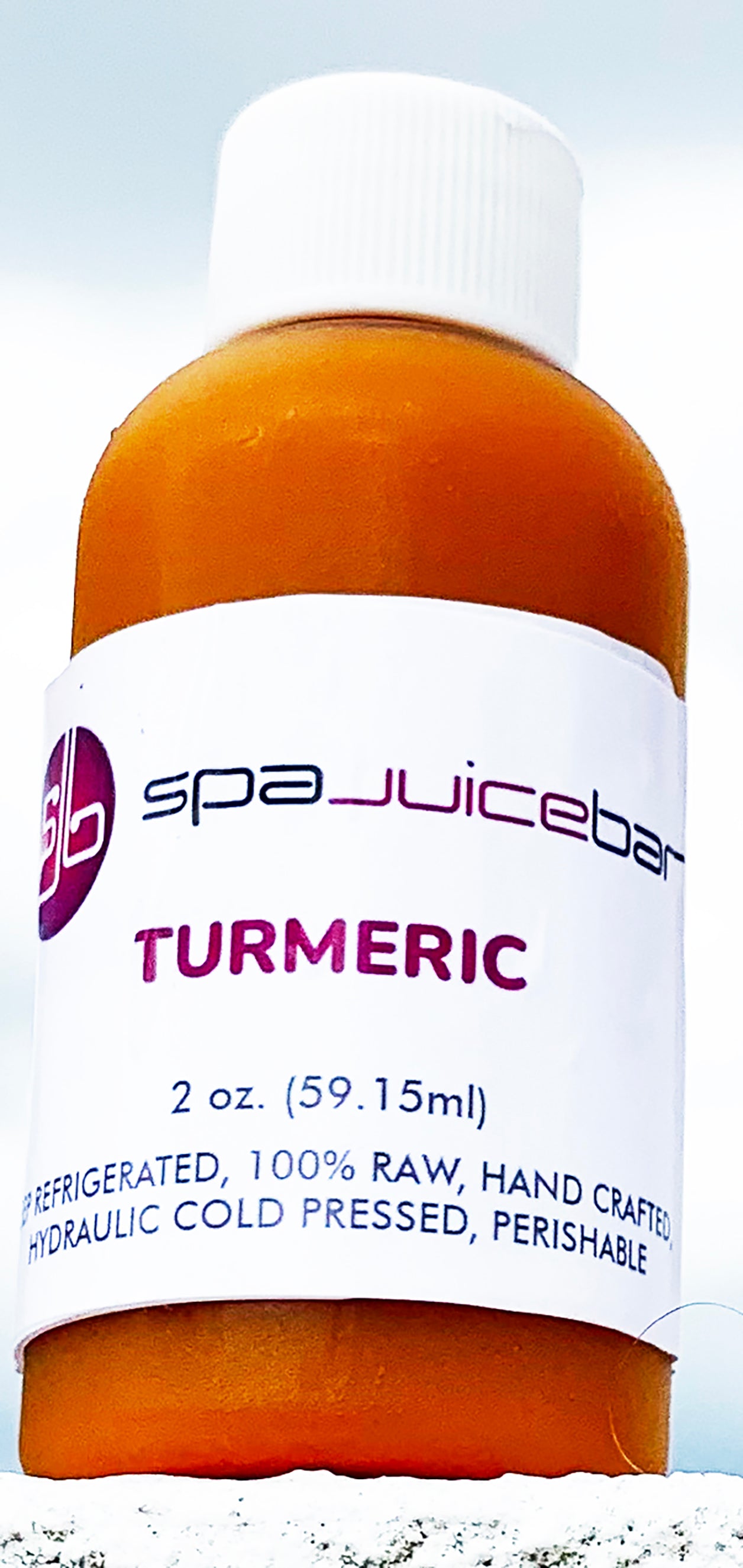 SpaJuiceBar cold pressed turmeric juice in a 2oz bottle. Turmeric is known to combat inflammation.