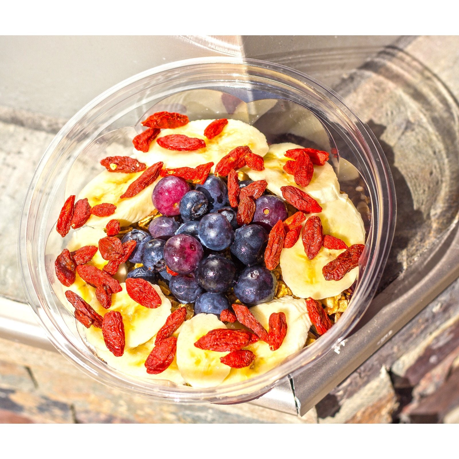 SpaJuiceBar Brazilian Acai Bowl is made with organic acai, banana and organic apple juice. The bowl is topped with organic GF homemade granola, bananas, organic blueberry, organic goji berries and honey.