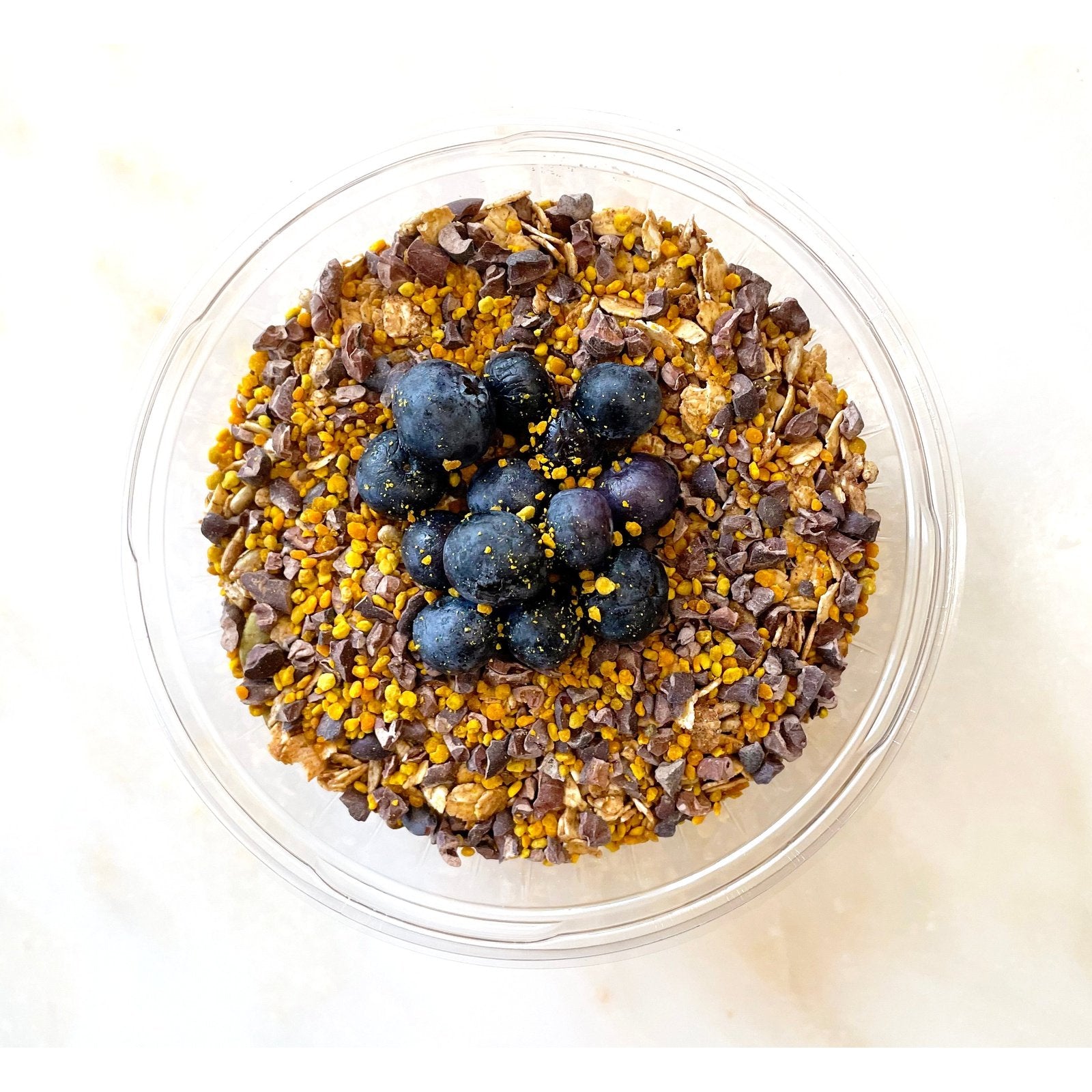 Nicole's Bowl was created by the fitness instructor Nicole. She wanted a bowl low in calories and with protein, maca, cacao, bee pollen and blueberries.  This bowl is a favorite.